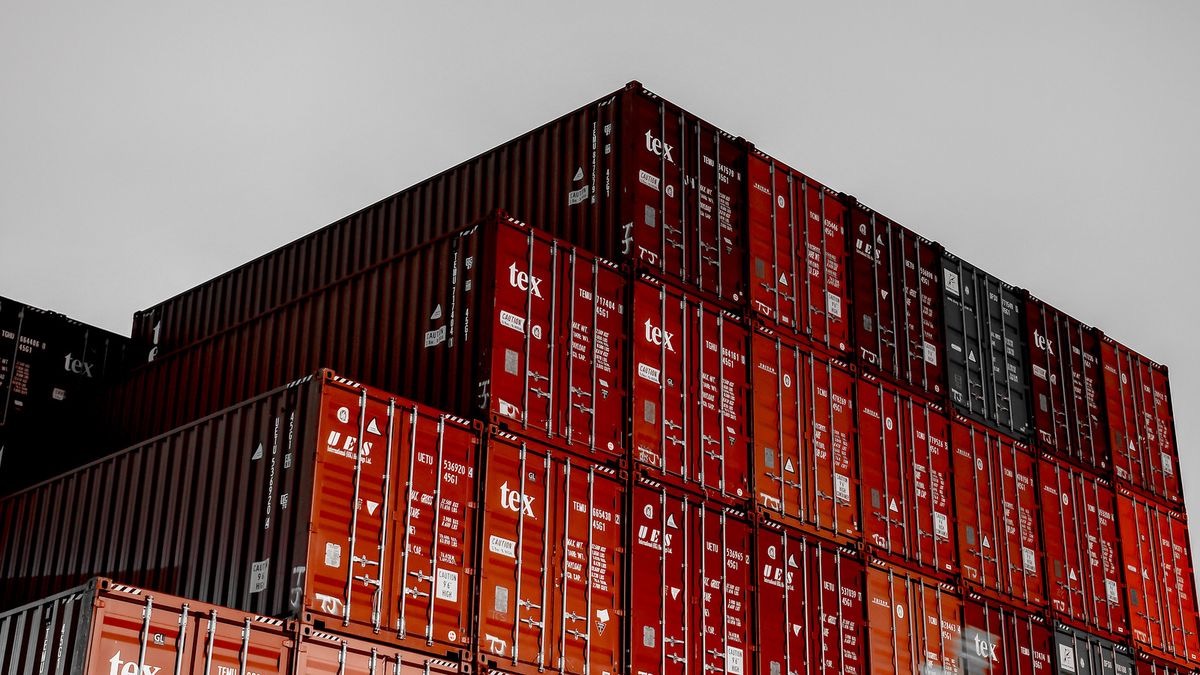 Stacked red shipping containers