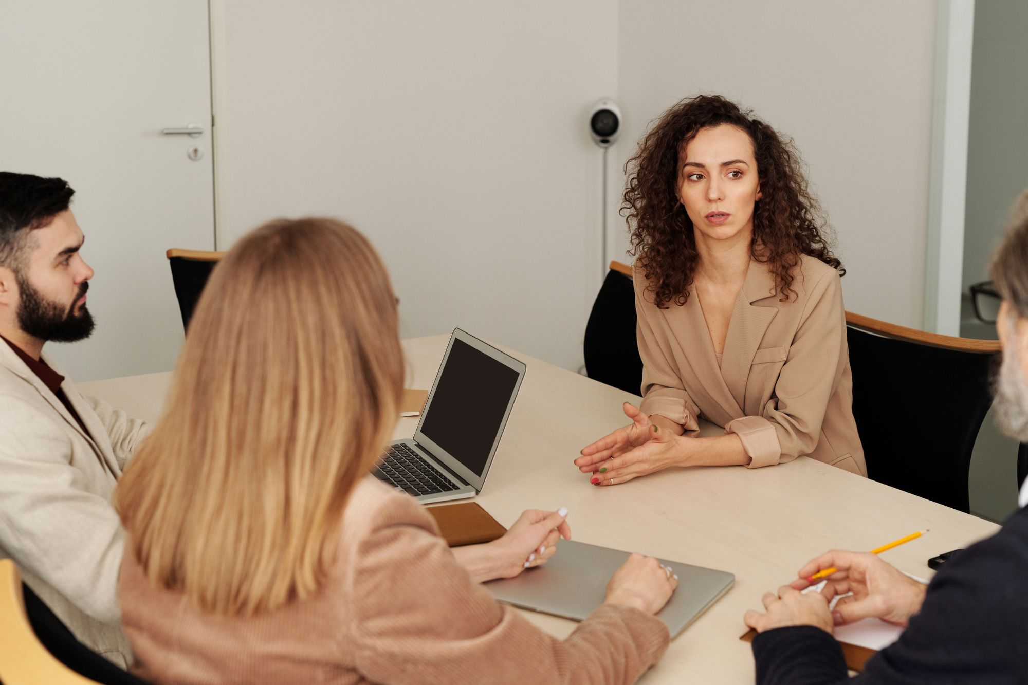 Team collaborating around an office meeting table
